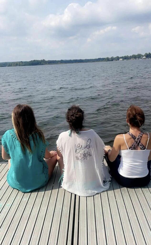 Sitting on a pier with my sisters over looking a lake and meditating