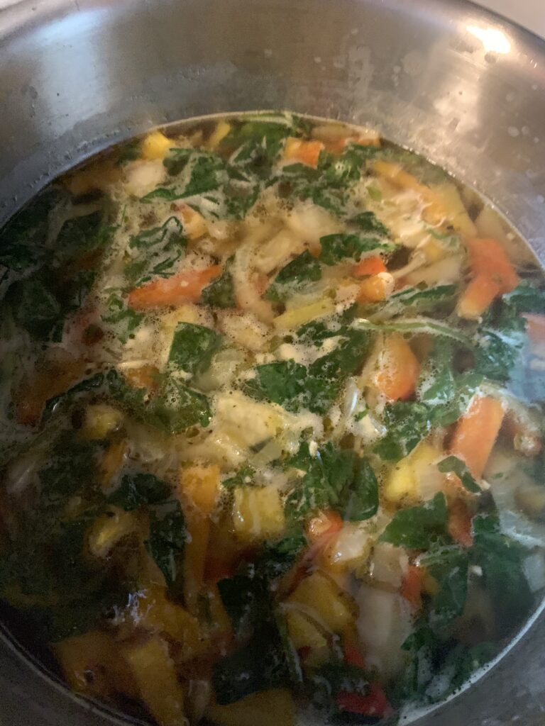 Vegetable Soup base. Chicken Broth, bell peppers, onions, garlic and chopped spinach. 