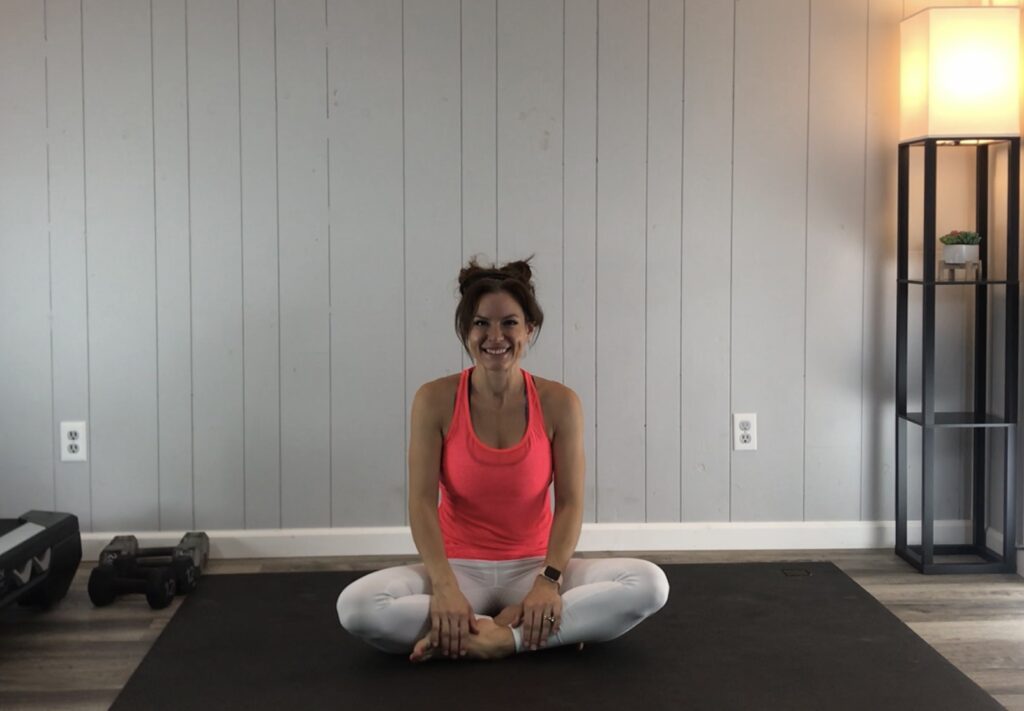 Sitting on the yoga mat getting ready to meditate